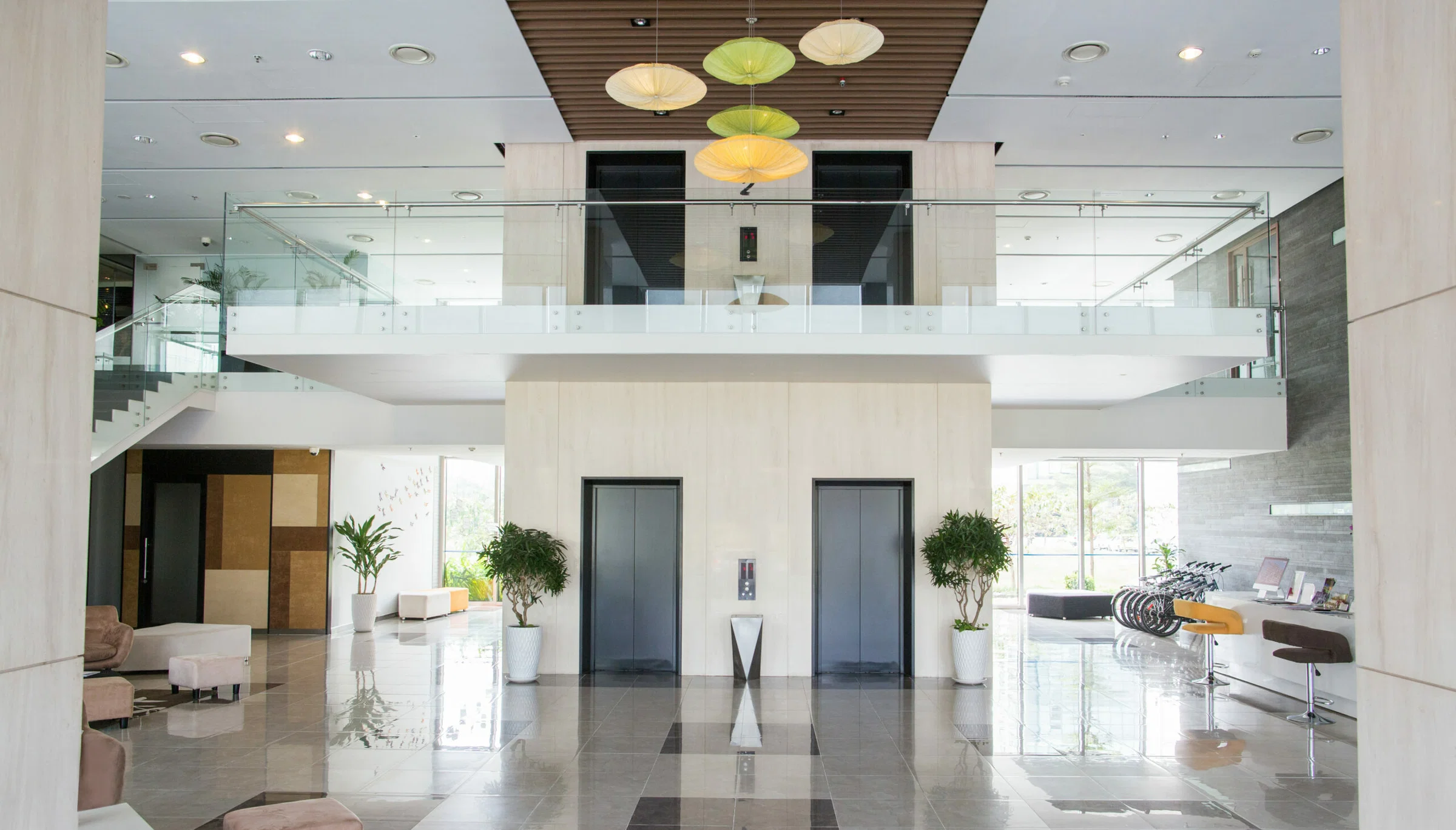 Empty lobby of condominium building. Elevators in hall of modern business center. Stylish interior design concept